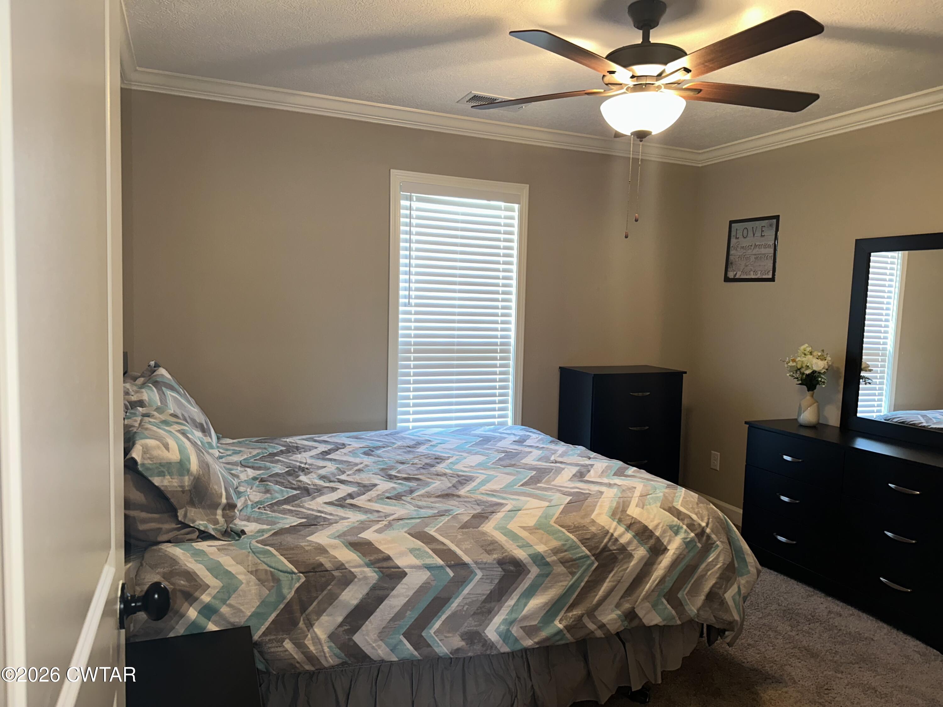103 Gatewick Drive Jackson, TN 38305 - Photo 18 of 29 a bedroom with a bed and a dresser