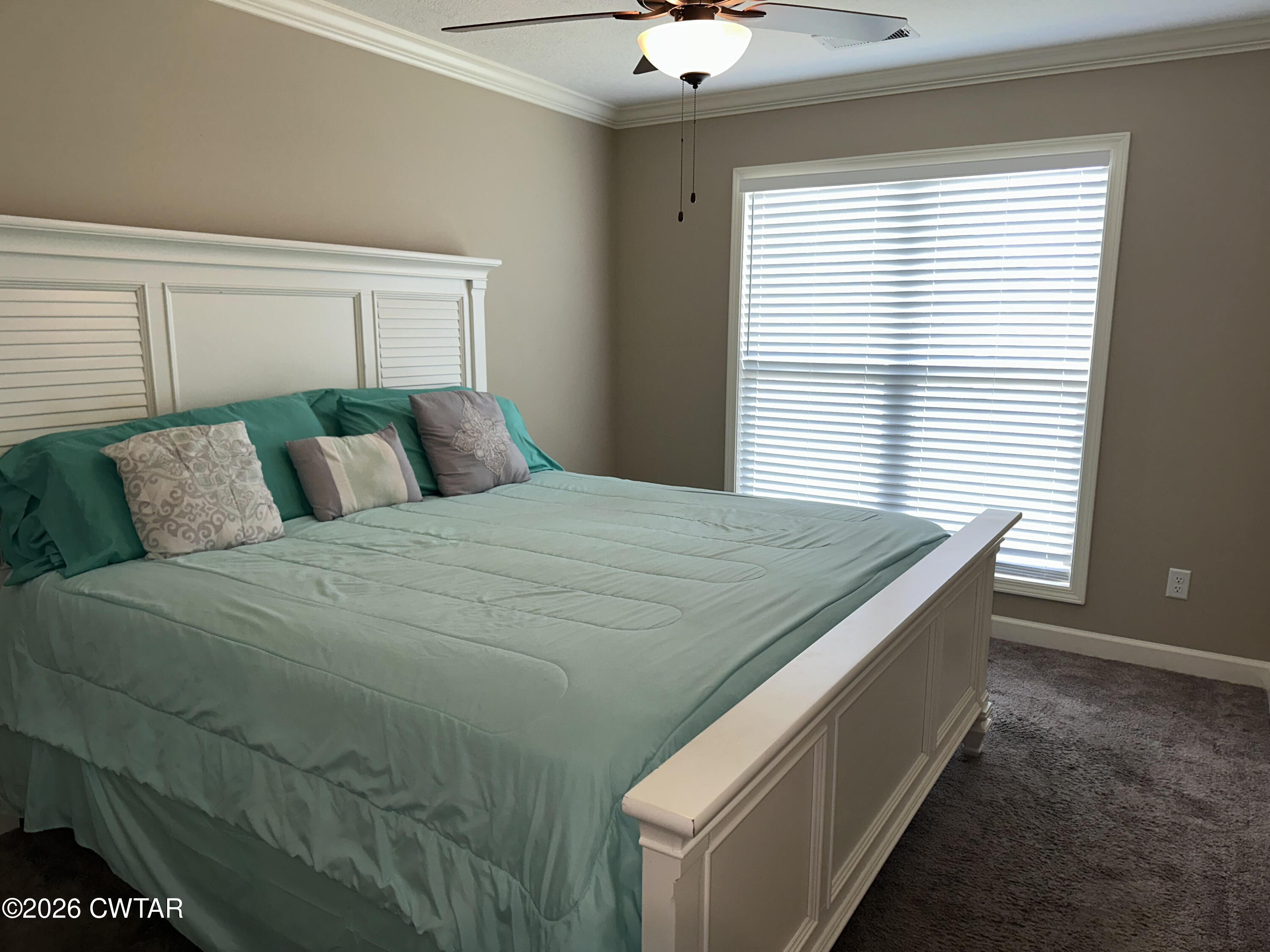 103 Gatewick Drive Jackson, TN 38305 - Photo 20 of 29 a bedroom with a bed and a window