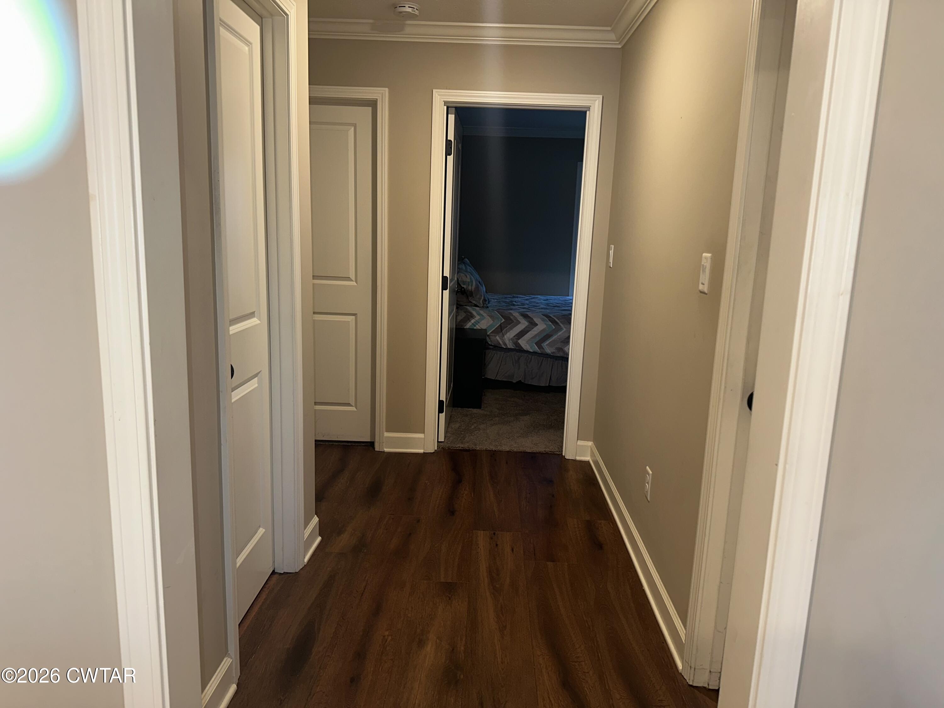 103 Gatewick Drive Jackson, TN 38305 - Photo 21 of 29 a view of a hallway with wooden floor and a bedroom