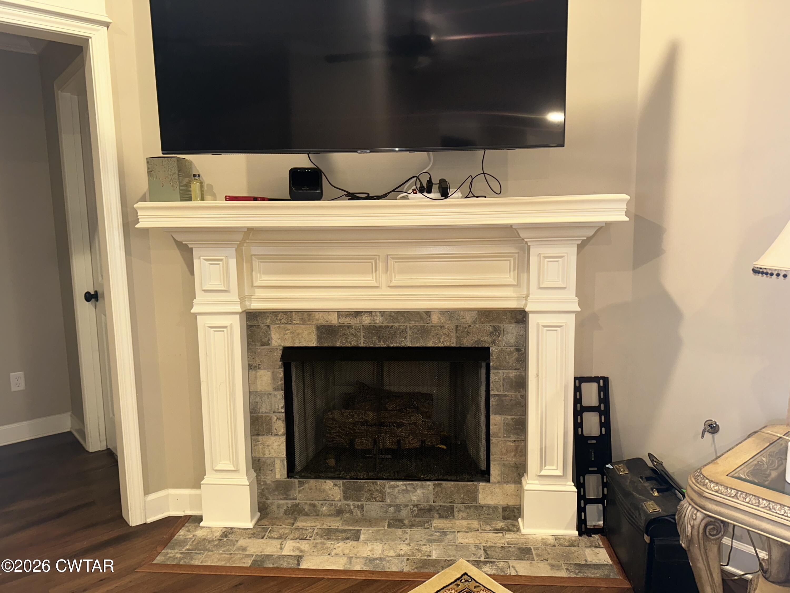 103 Gatewick Drive Jackson, TN 38305 - Photo 5 of 29 a living room with furniture and a fireplace