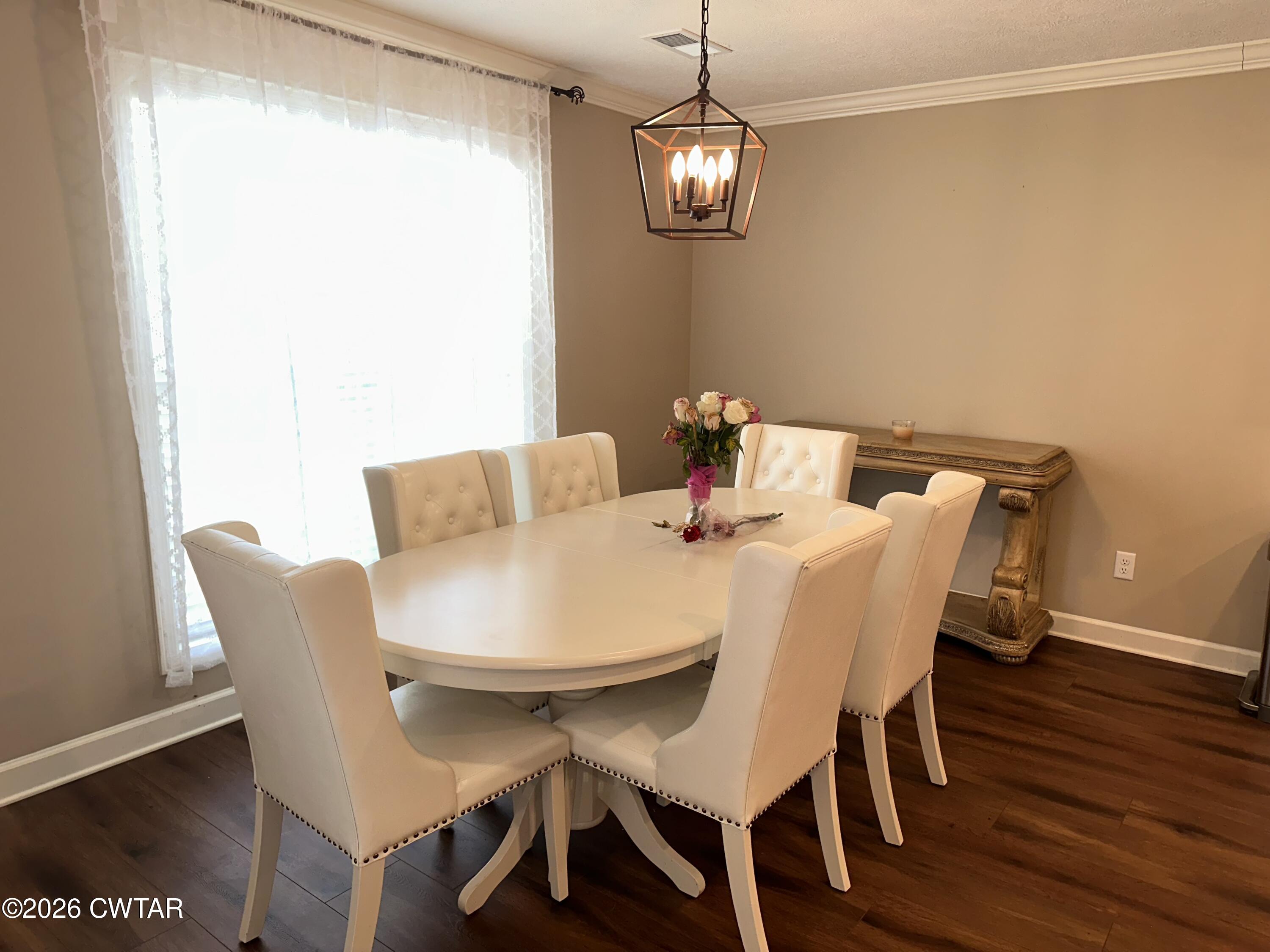 103 Gatewick Drive Jackson, TN 38305 - Photo 7 of 29 a view of a dining room with furniture and wooden floor