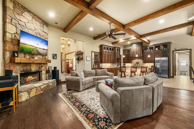 a living room with fireplace furniture and a flat screen tv