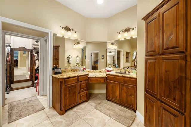 a large kitchen with a stove and refrigerator