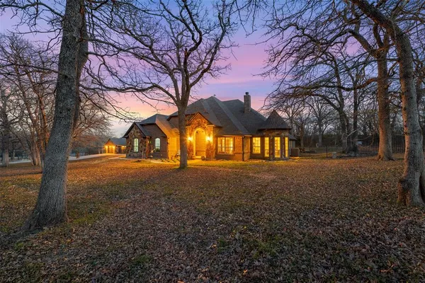 a view of road with large trees