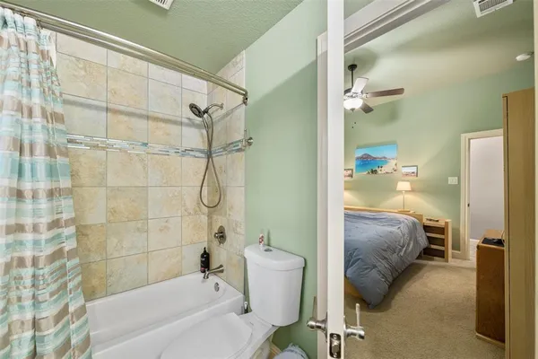 a en suite bathroom with a bathtub and shower