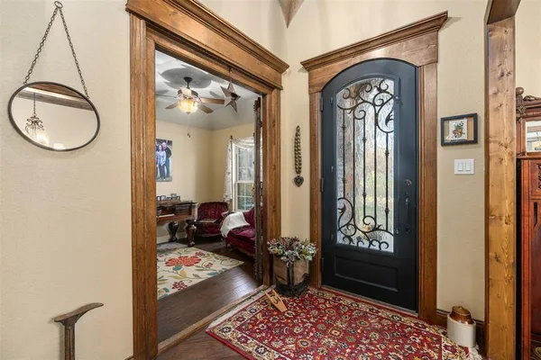 a very nice looking room with a mirror and a rug