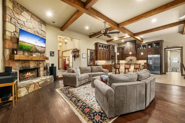 a kitchen with granite countertop a stove and a refrigerator