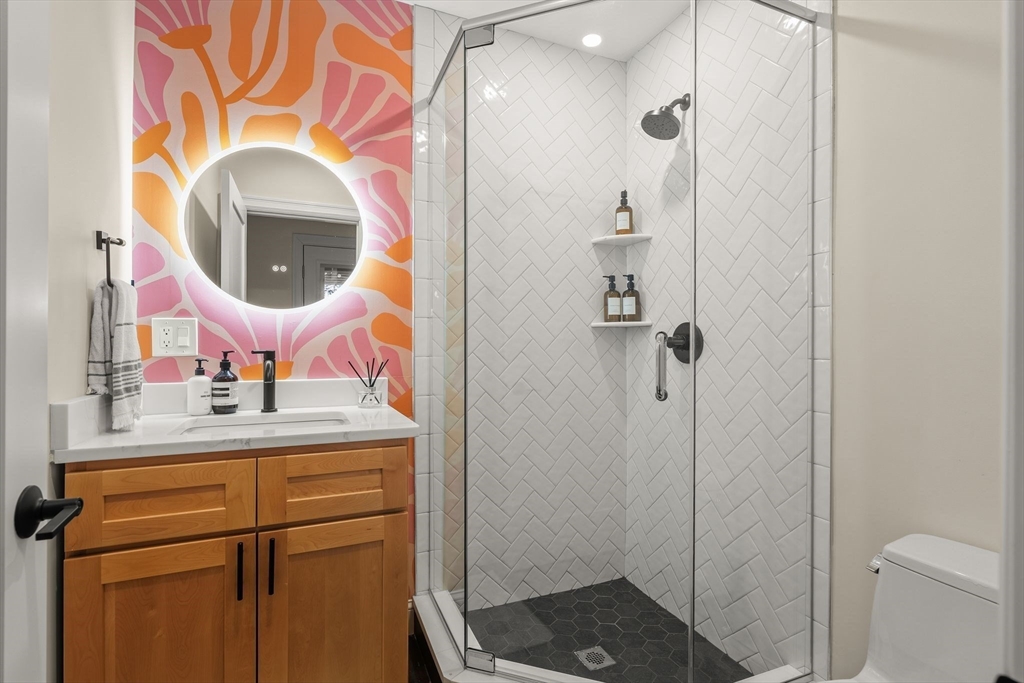 753 East Broadway, Unit 2A Boston, MA 02127 - Photo 12 of 17 a bathroom with a sink and a mirror