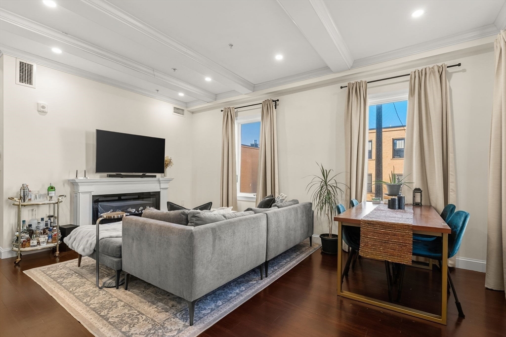 753 East Broadway, Unit 2A Boston, MA 02127 - Photo 4 of 17 a living room with furniture and a flat screen tv