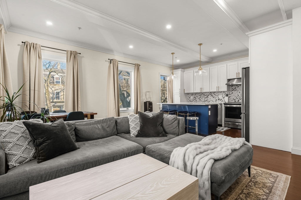 753 East Broadway, Unit 2A Boston, MA 02127 - Photo 5 of 17 a living room with furniture and a large window