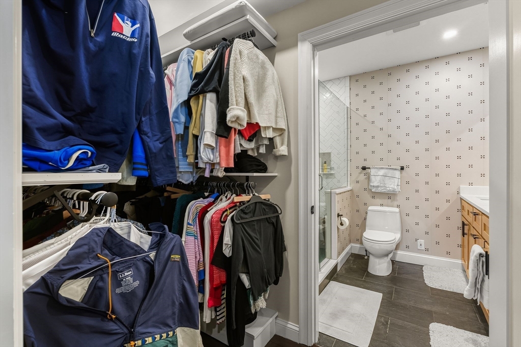 753 East Broadway, Unit 2A Boston, MA 02127 - Photo 9 of 17 a view of walk in closet with clothes and shoes