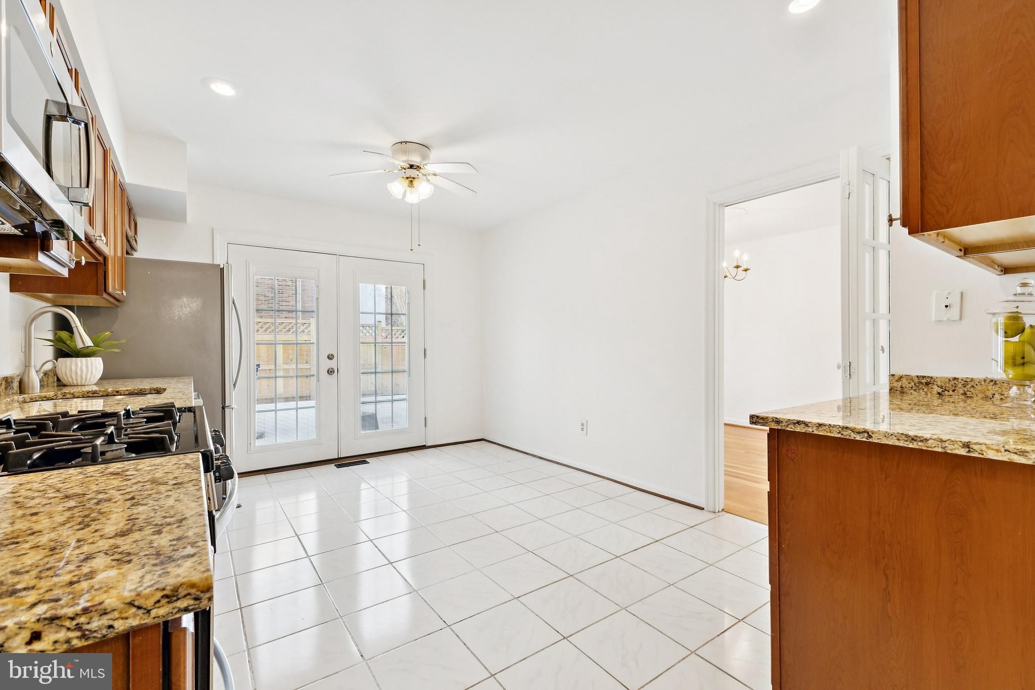 9896 Cardinal Road Fairfax, VA 22030 - Photo 13 of 44 a view of a kitchen with a sink and a refrigerator
