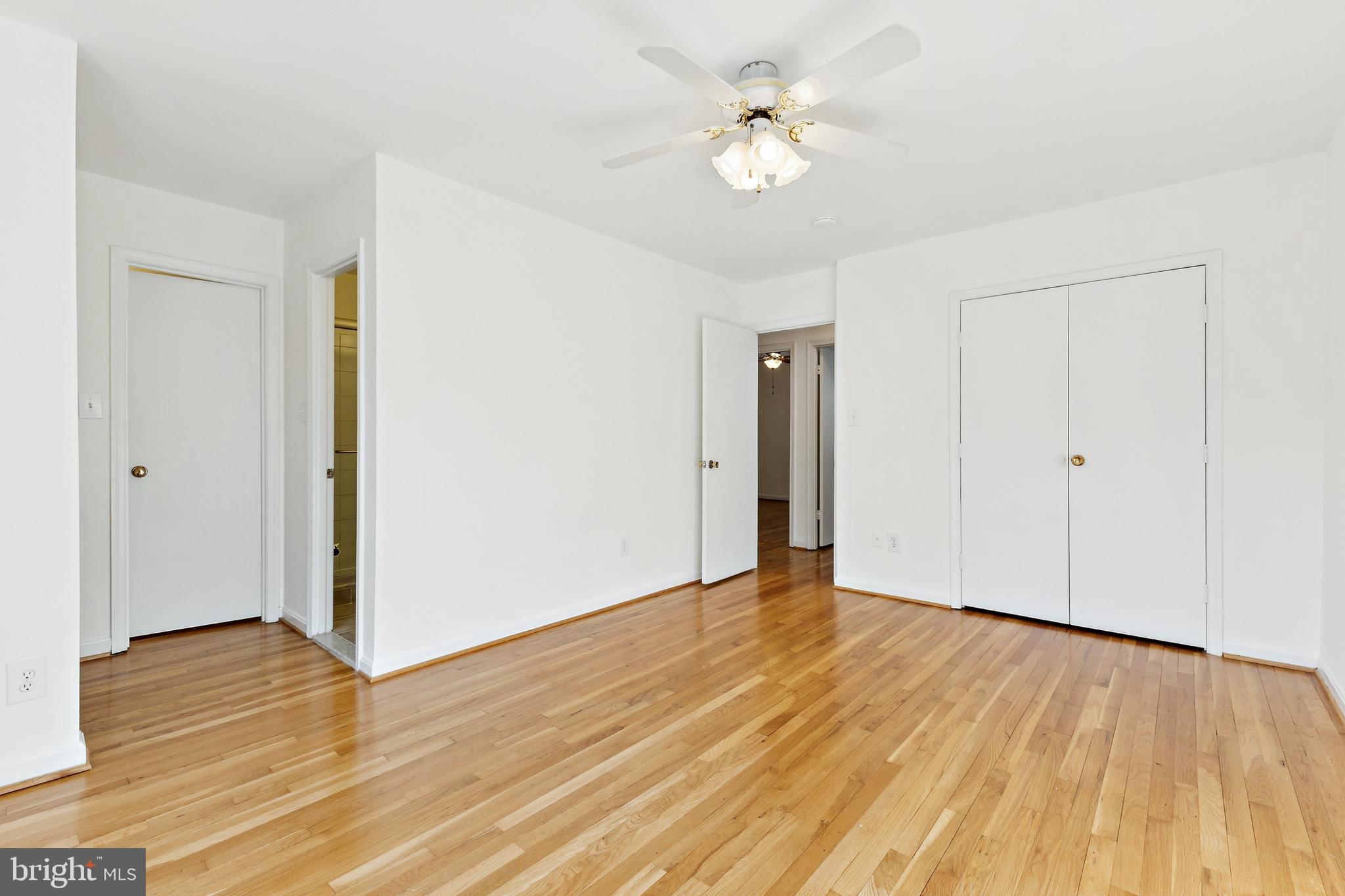 9896 Cardinal Road Fairfax, VA 22030 - Photo 19 of 44 a view of an empty room with wooden floor