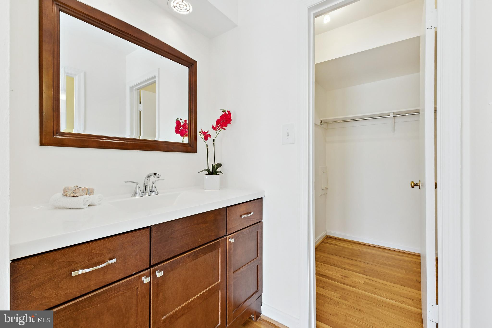9896 Cardinal Road Fairfax, VA 22030 - Photo 20 of 44 a bathroom with a sink vanity and a mirror
