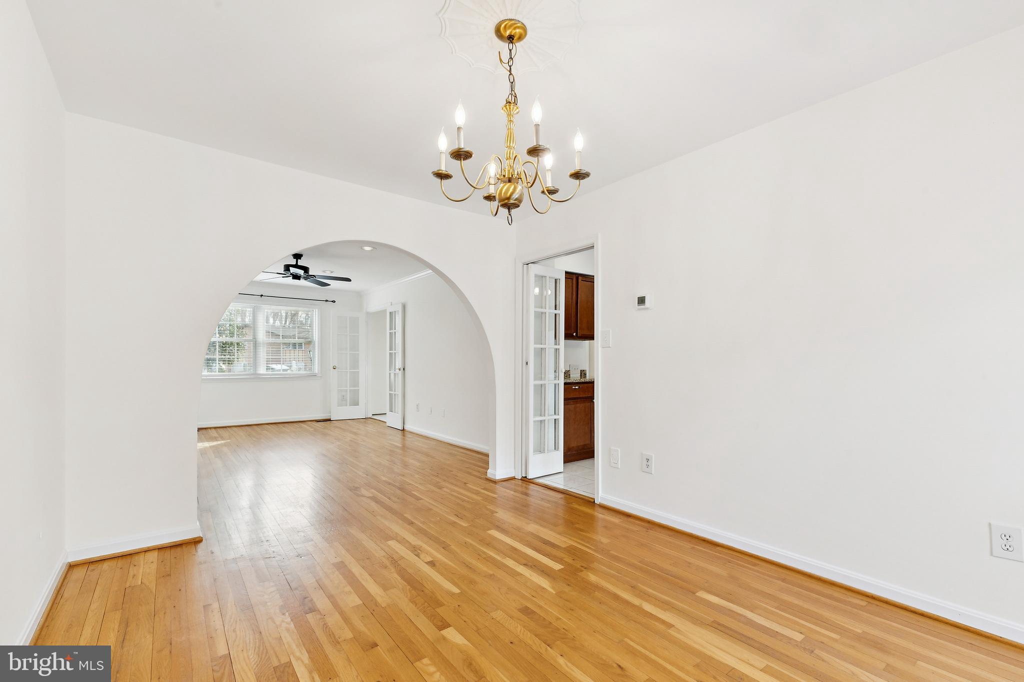 9896 Cardinal Road Fairfax, VA 22030 - Photo 8 of 44 a view of a livingroom with a chandelier fan