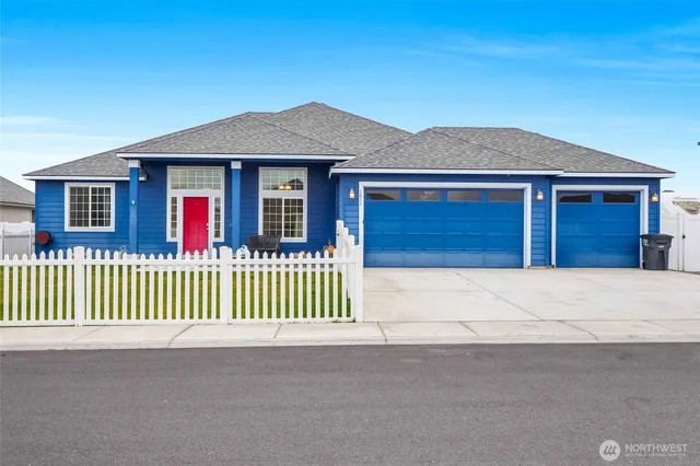 a front view of a house with a garage
