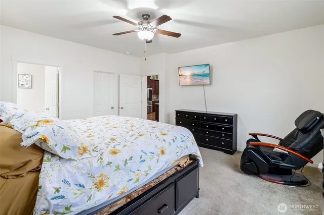 a bedroom with a bed and a chandelier