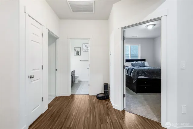 a view of a livingroom with walk in closet and bedroom