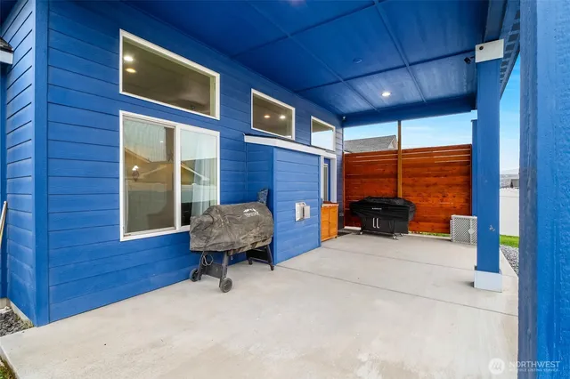a view of backyard with a garden and deck