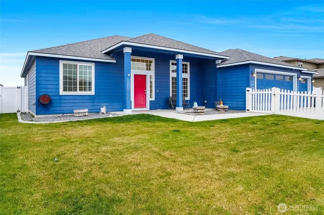 a house view with swimming pool in front of it