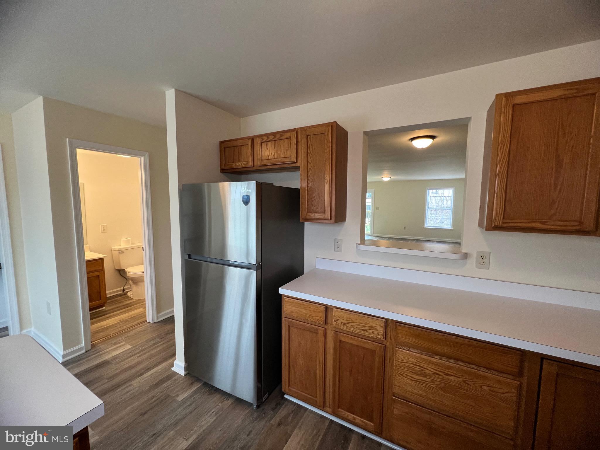 15 Mistala Court Inwood, WV 25428 - Photo 13 of 35 a kitchen with a refrigerator and a sink