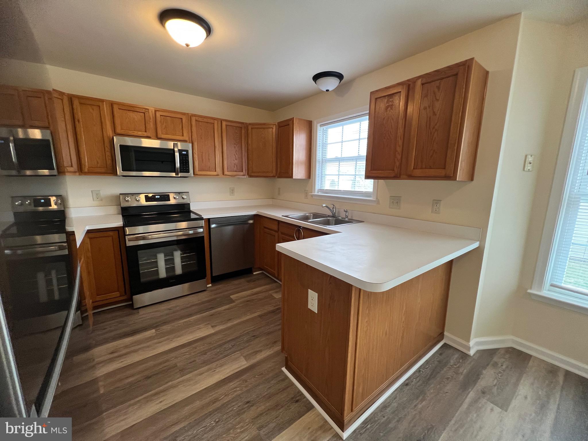 15 Mistala Court Inwood, WV 25428 - Photo 16 of 35 a kitchen that has a sink and a stove top oven