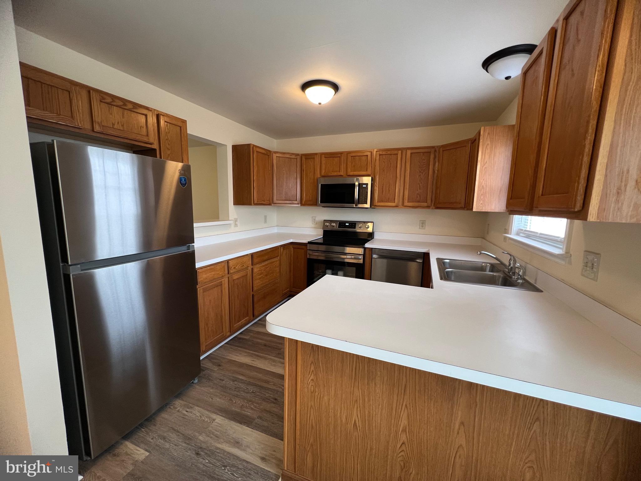 15 Mistala Court Inwood, WV 25428 - Photo 17 of 35 a kitchen with stainless steel appliances a refrigerator sink and microwave