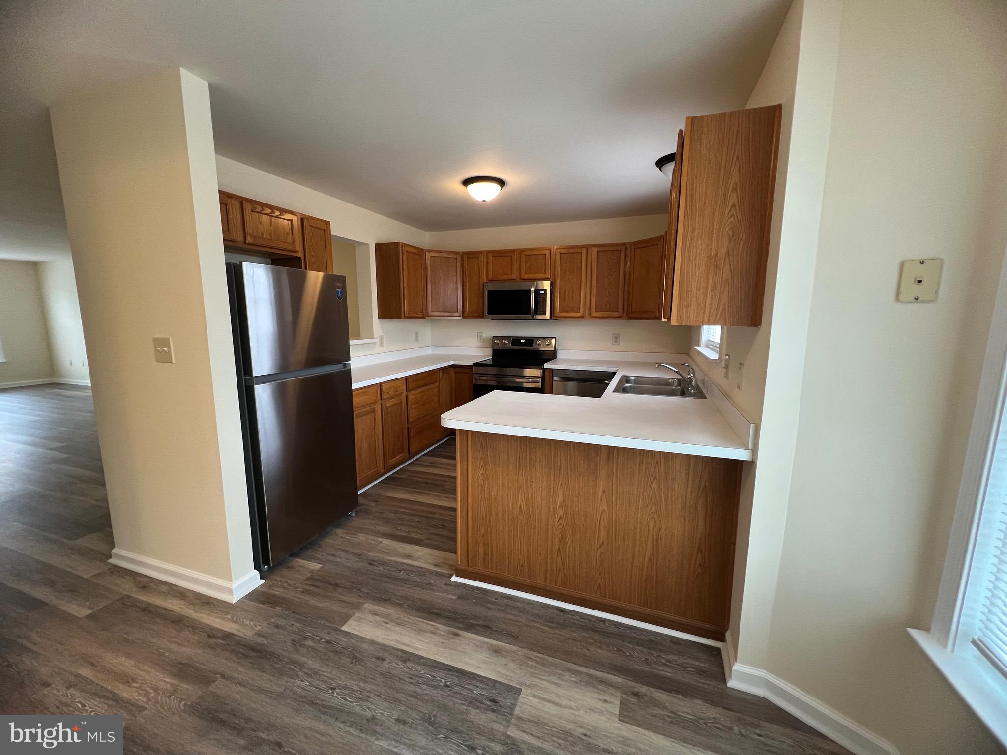 15 Mistala Court Inwood, WV 25428 - Photo 18 of 35 a kitchen with stainless steel appliances a refrigerator sink and microwave