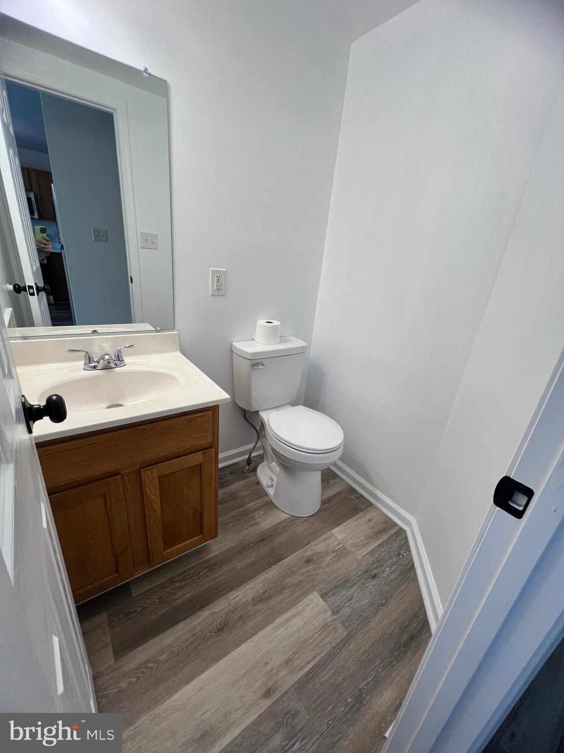 15 Mistala Court Inwood, WV 25428 - Photo 19 of 35 a bathroom with a sink a toilet a mirror and vanity