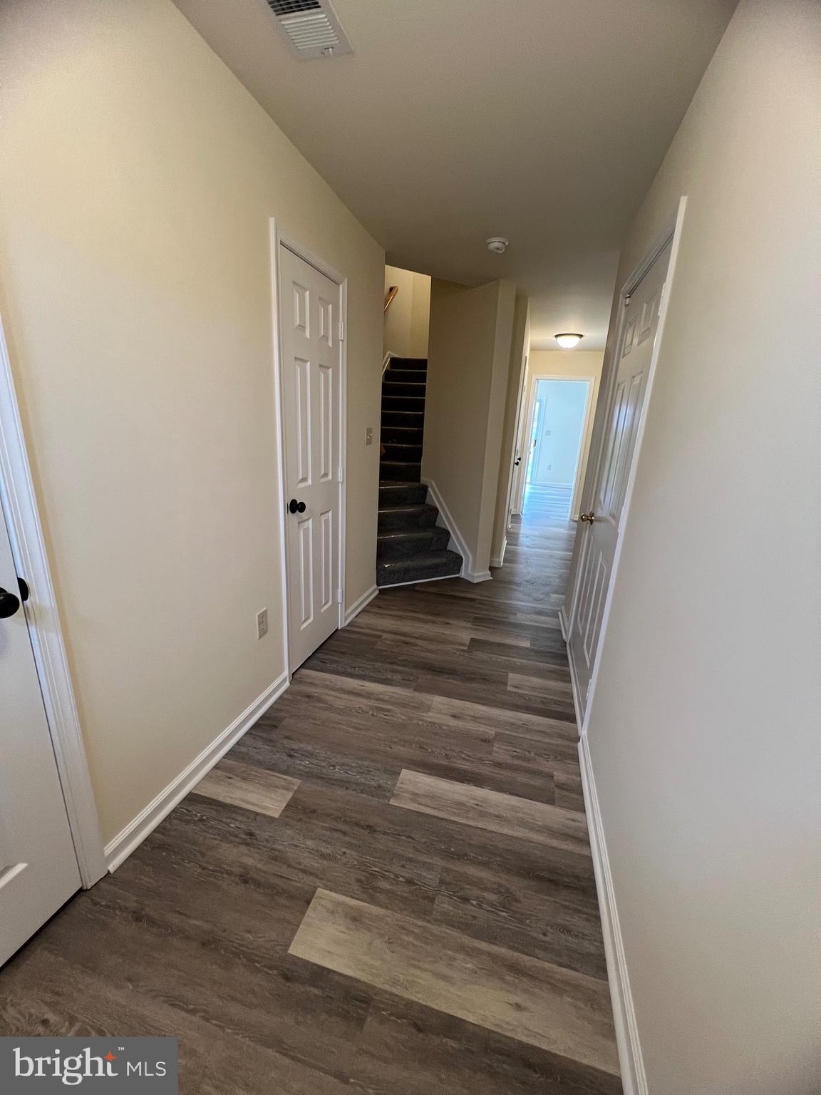 15 Mistala Court Inwood, WV 25428 - Photo 2 of 35 a view of a hallway with wooden floor and staircase