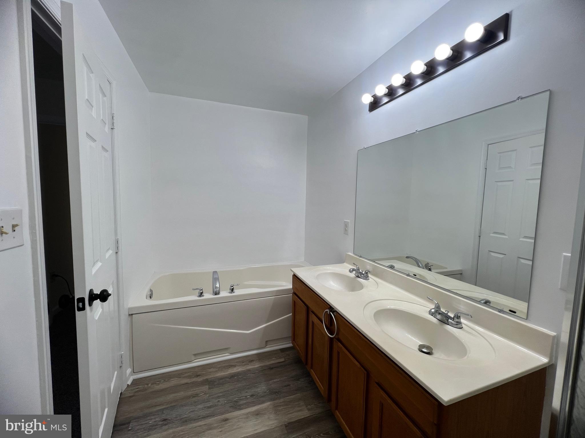 15 Mistala Court Inwood, WV 25428 - Photo 25 of 35 a bathroom with a sink and a mirror