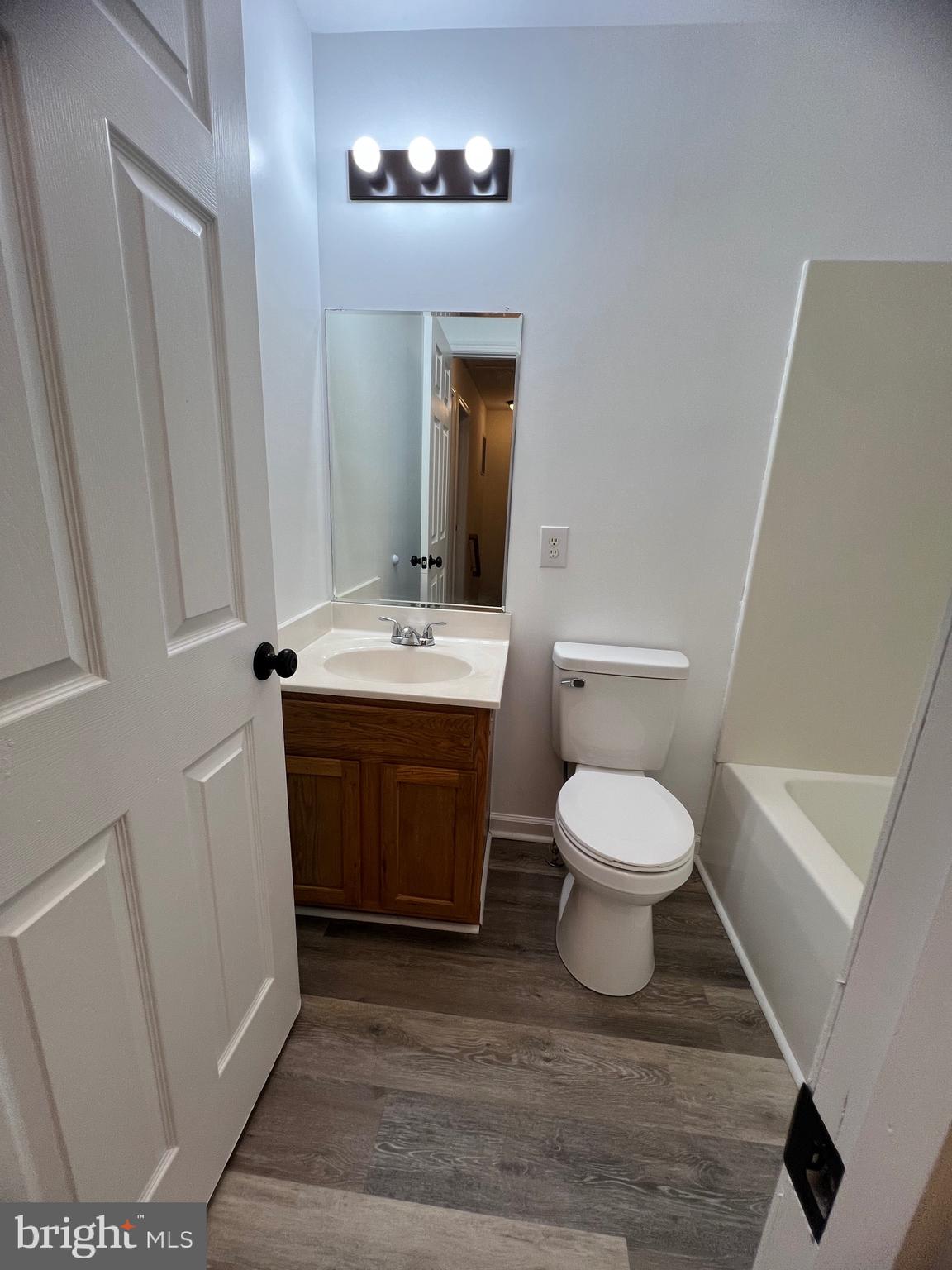 15 Mistala Court Inwood, WV 25428 - Photo 29 of 35 a bathroom with a toilet a sink and mirror