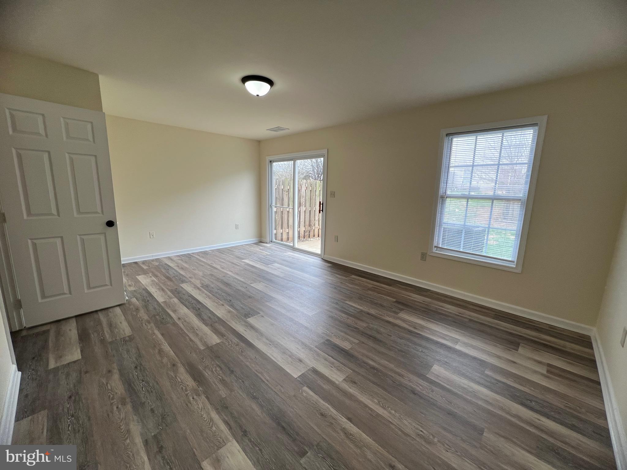 15 Mistala Court Inwood, WV 25428 - Photo 5 of 35 an empty room with wooden floor and windows