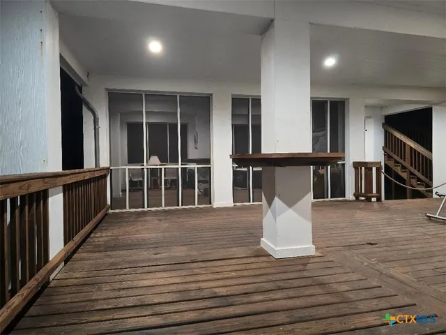 a view of a living room and wooden floor