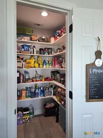 a room with lots of different colored cloths