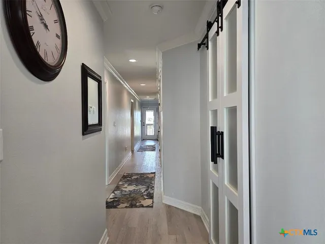 a view of a hallway with entryway