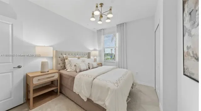 a bedroom with a bed and a large window with the view of bedroom