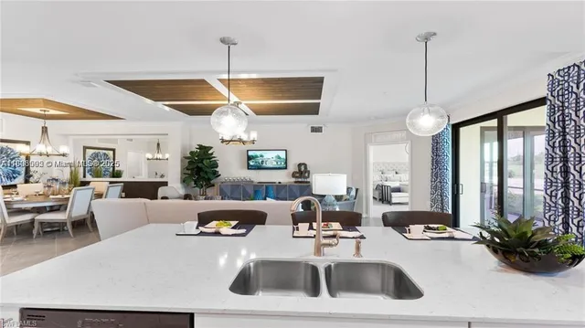 a kitchen with refrigerator a microwave a stove and cabinets