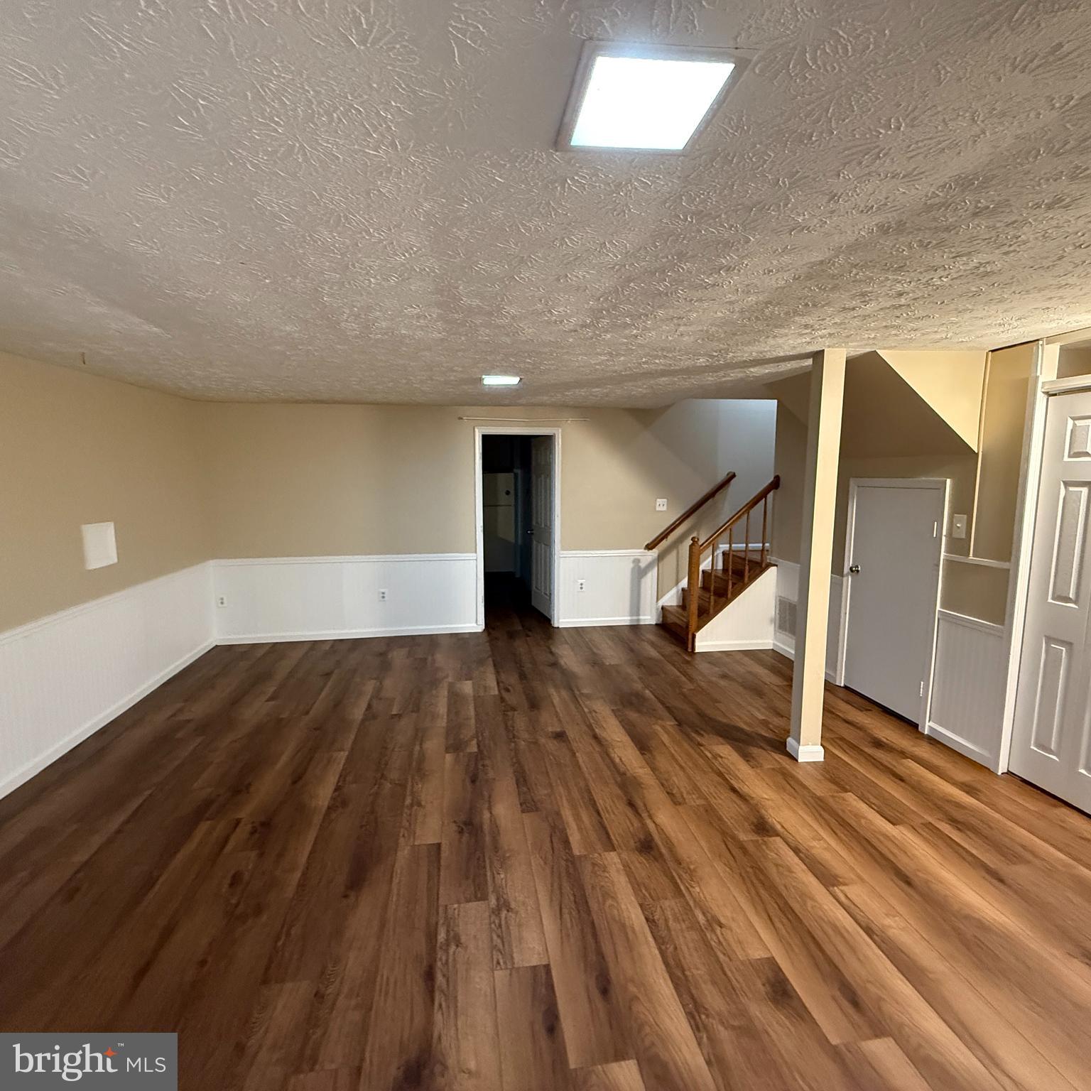 8222 Maple Ridge Avenue Springfield, VA 22153 - Photo 19 of 25 a view of entryway with wooden floor