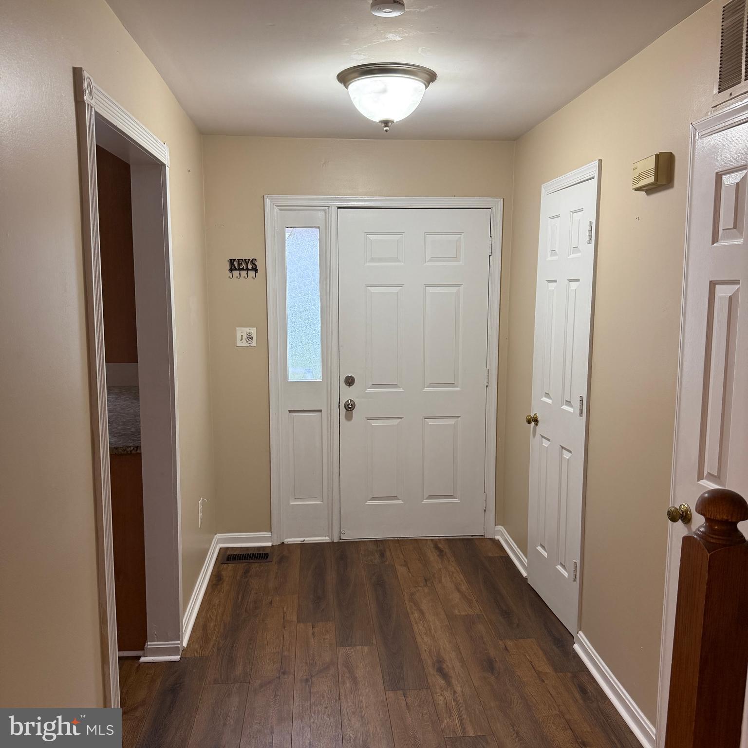 8222 Maple Ridge Avenue Springfield, VA 22153 - Photo 3 of 25 wooden floor & windows in a room