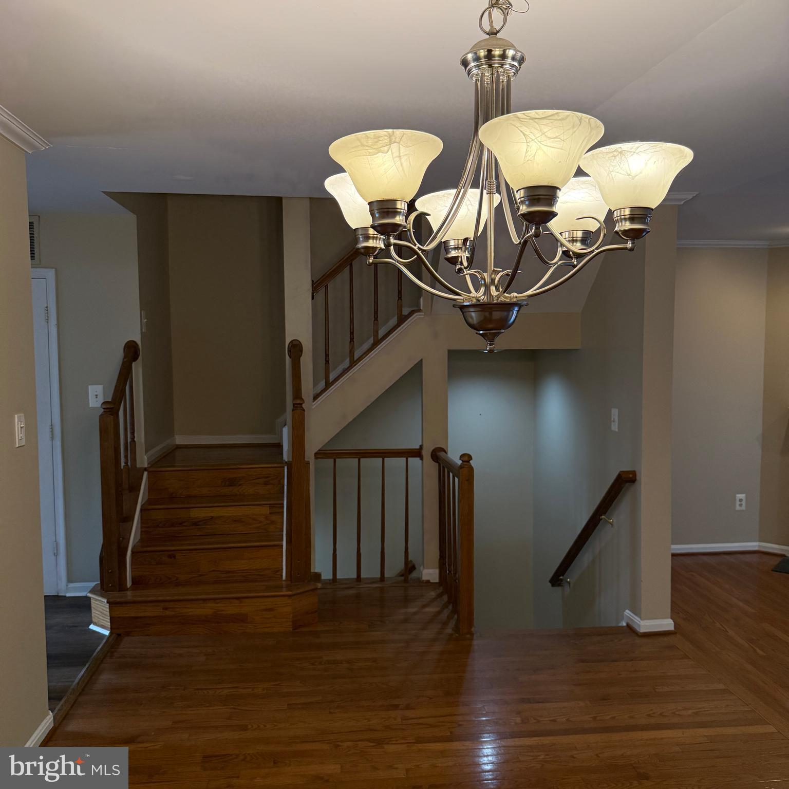 8222 Maple Ridge Avenue Springfield, VA 22153 - Photo 7 of 25 a view of entryway and hall with wooden floor