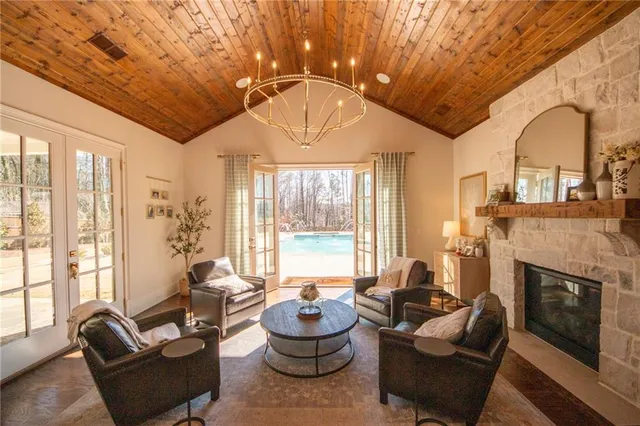 a large kitchen with stainless steel appliances granite countertop a stove and wooden floor