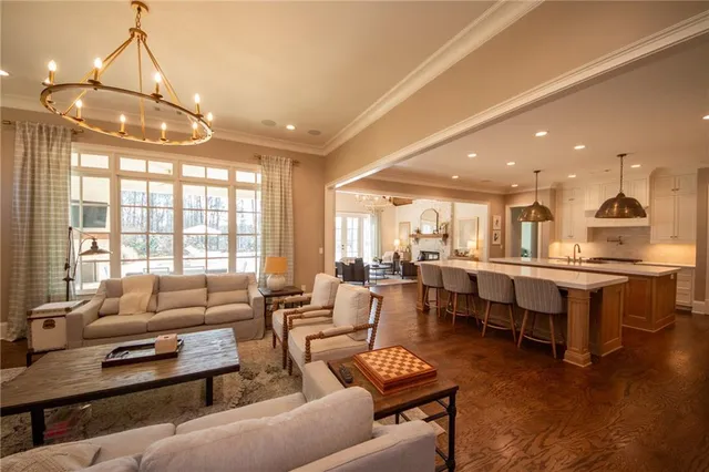 a dining room with a fireplace and a flat screen tv