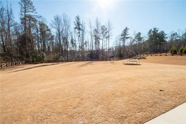 a view of a livingroom with furniture and a flat screen tv