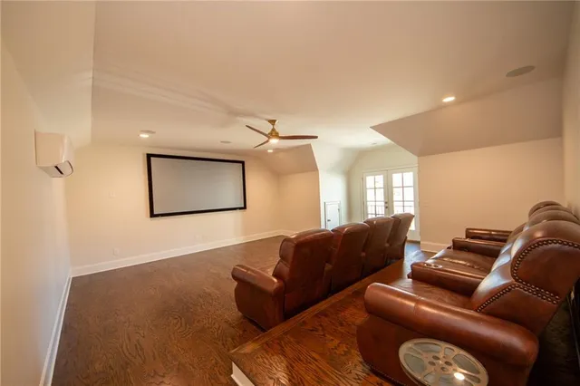 a view of a hallway with closet and wooden floor