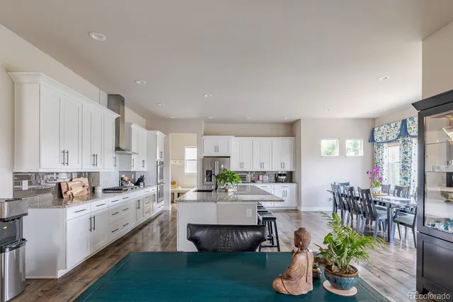 a kitchen with counter top space cabinets and appliances