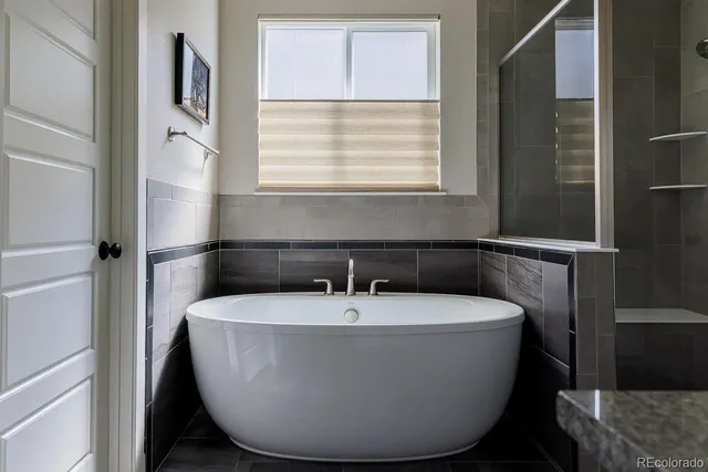 a white bath tub sitting in a bathroom