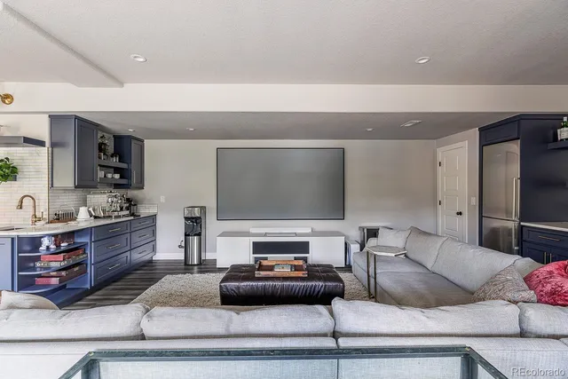 a view of a livingroom with workspace and a window