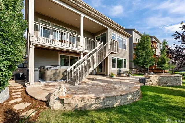a front view of house with a garden