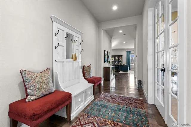 a living room with furniture and a rug